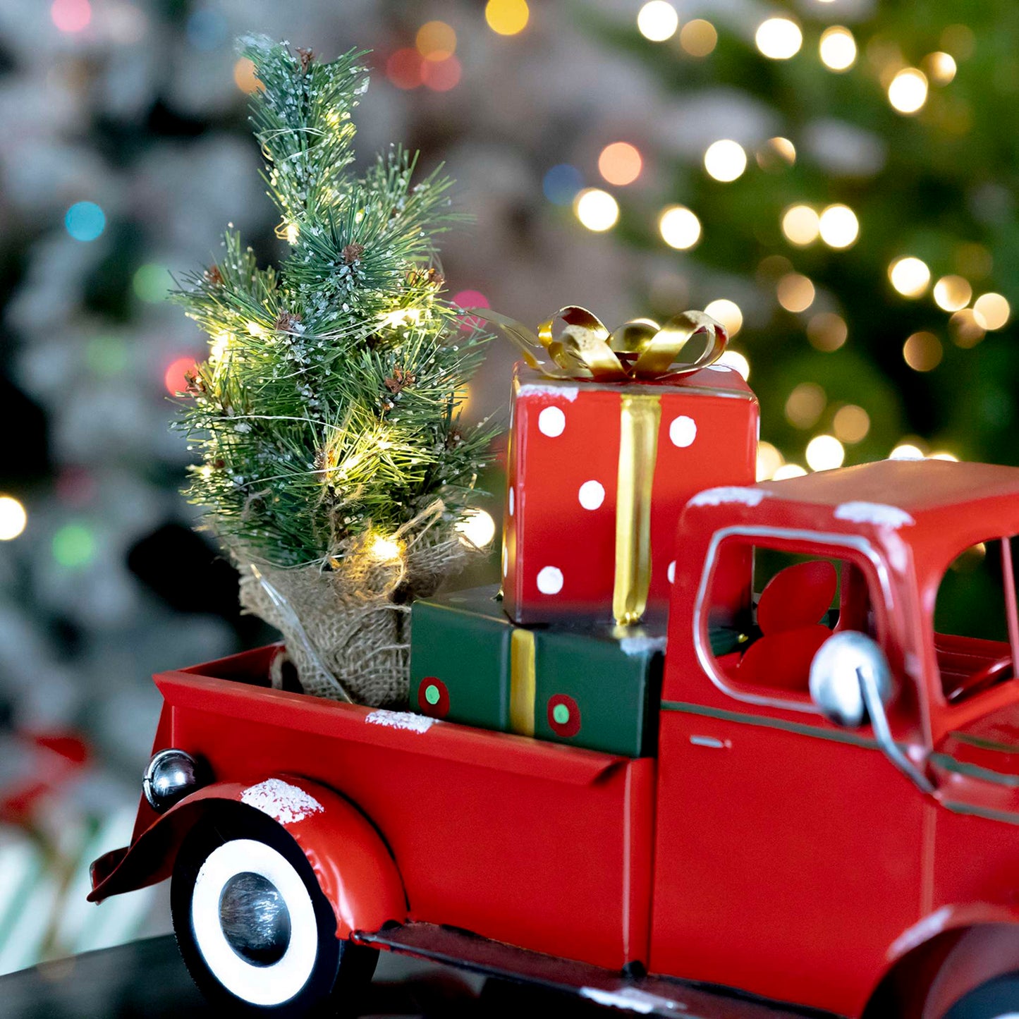 Christmas Snow Covered Pickup Truck with Lighted Christmas Tree and Gifts