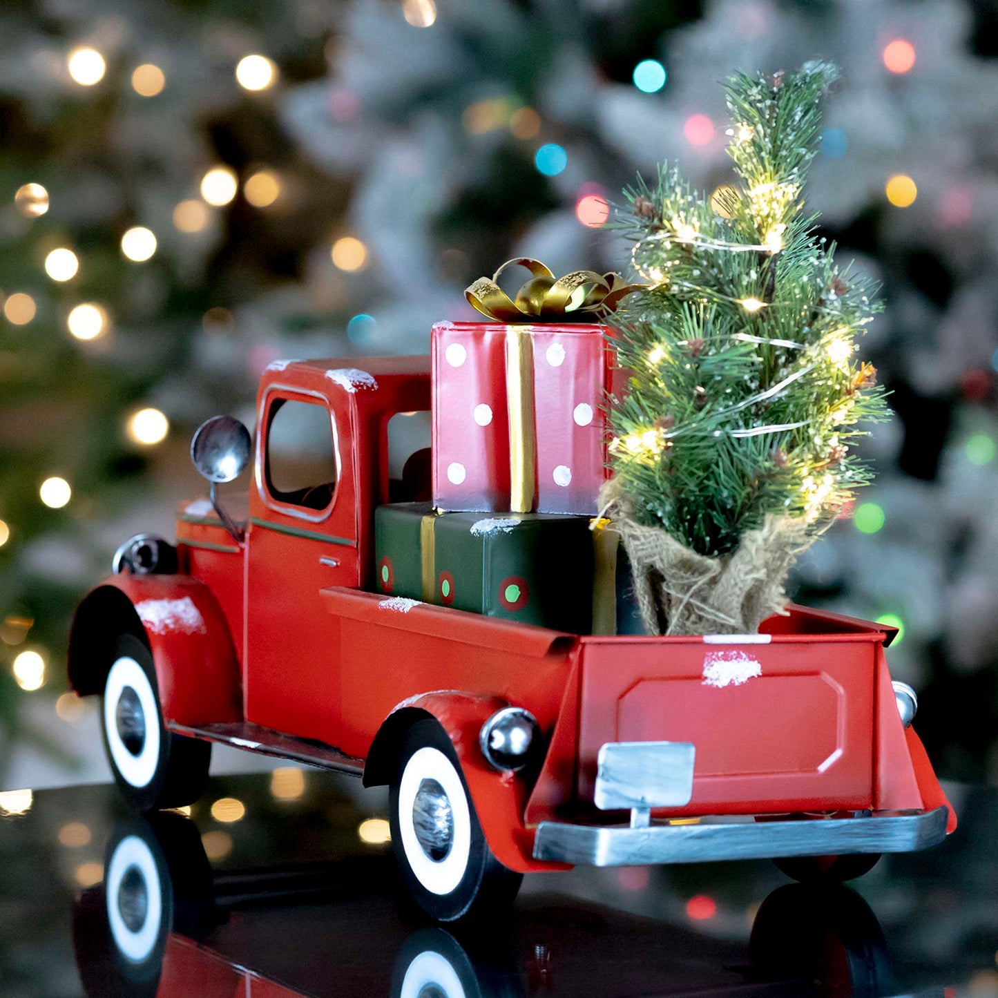 Christmas Snow Covered Pickup Truck with Lighted Christmas Tree and Gifts