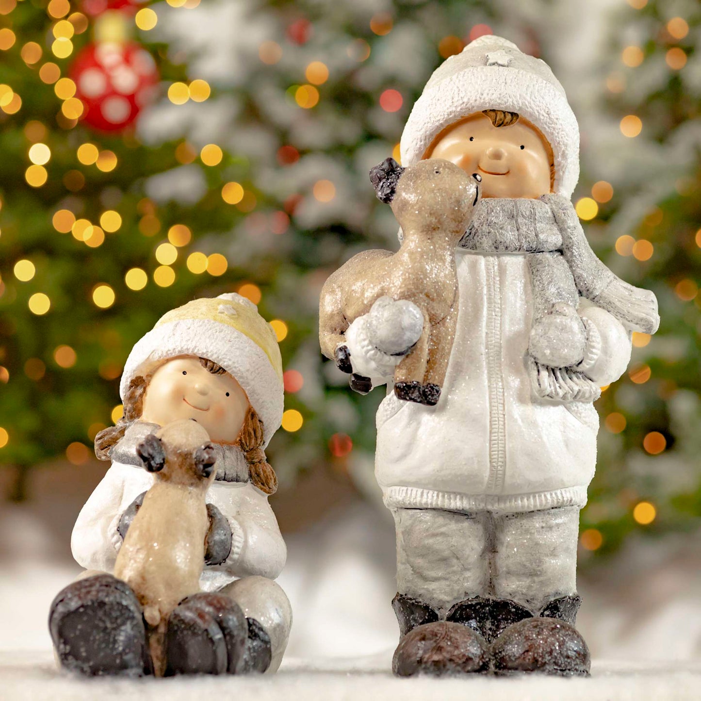 Christmas Set of 2 Tushka Snow Children in White Holding Baby Reindeer